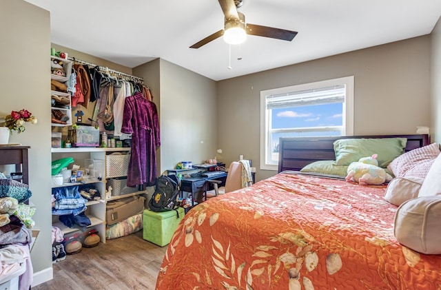 bedroom featuring ceiling fan and wood finished floors