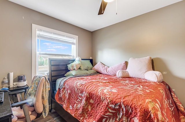 bedroom with wood finished floors and ceiling fan