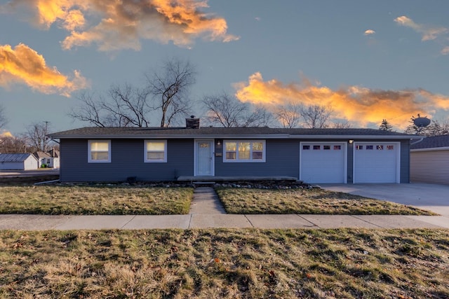 single story home with concrete driveway, a garage, and a chimney