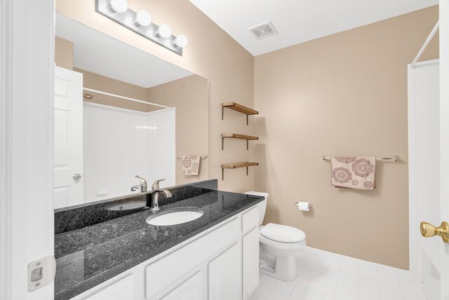 bathroom with visible vents, baseboards, toilet, tile patterned floors, and vanity