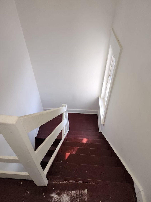 stairs with wood finished floors