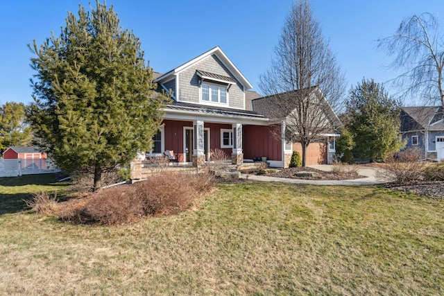 view of front of property featuring a garage, a front lawn, a porch, and board and batten siding