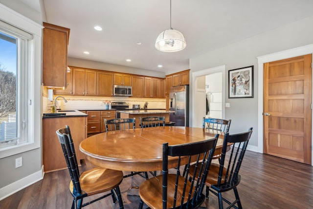 dining area featuring recessed lighting, baseboards, and dark wood-style floors