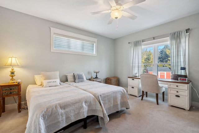 bedroom with light carpet, visible vents, ceiling fan, and baseboards