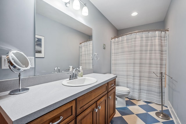 bathroom with tile patterned floors, toilet, and vanity