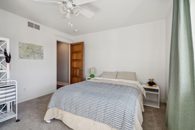 bedroom with visible vents, carpet floors, baseboards, and a ceiling fan