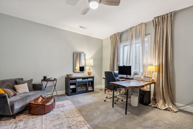 office space with ceiling fan, carpet, visible vents, and baseboards