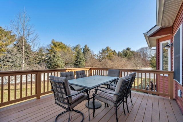 wooden terrace featuring outdoor dining area