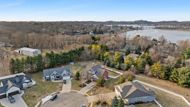 birds eye view of property with a water view