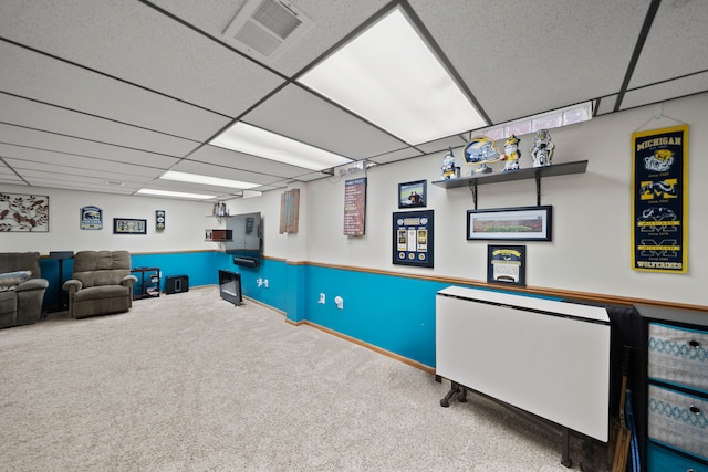 recreation room featuring a drop ceiling, visible vents, and carpet