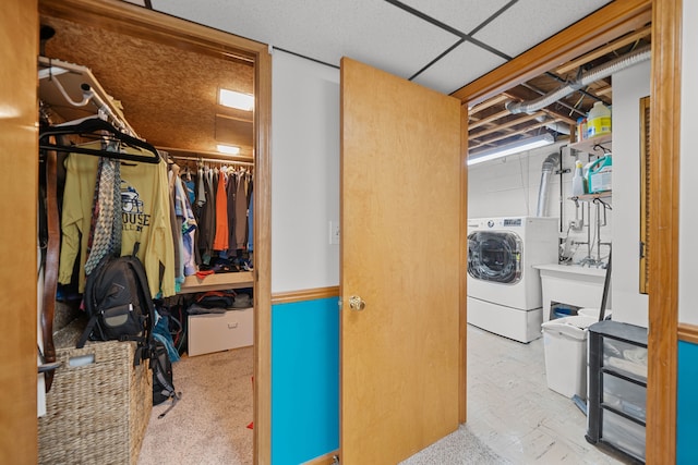 unfinished basement featuring washer / clothes dryer and a sink