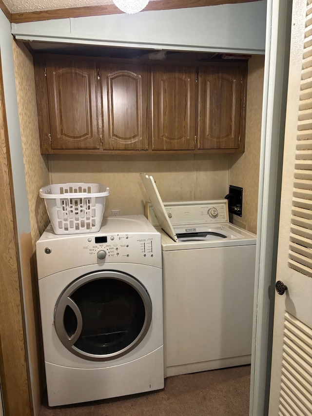 laundry area with cabinet space and washer and dryer