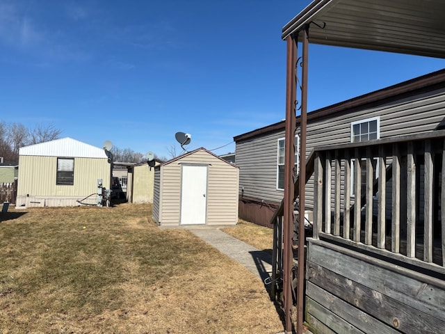 view of yard with an outbuilding and a storage shed