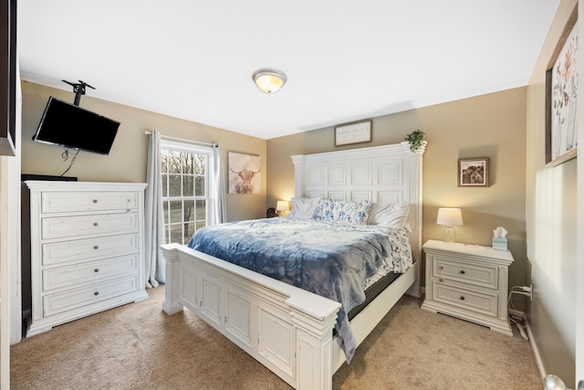 bedroom featuring light colored carpet