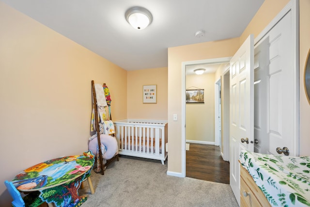 carpeted bedroom with baseboards