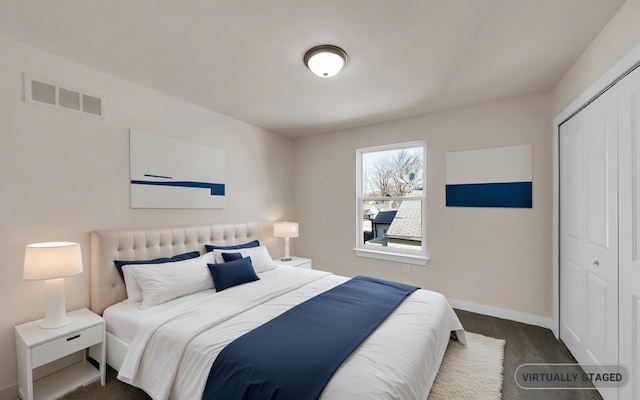 carpeted bedroom with baseboards, visible vents, and a closet