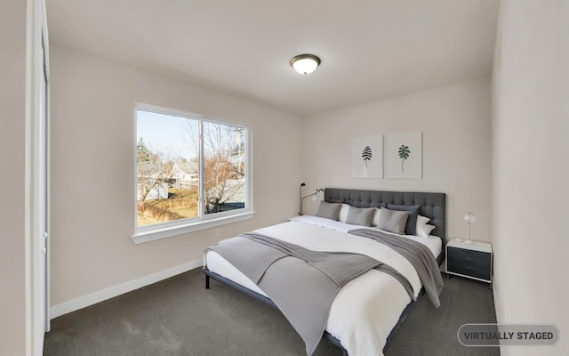 carpeted bedroom featuring baseboards