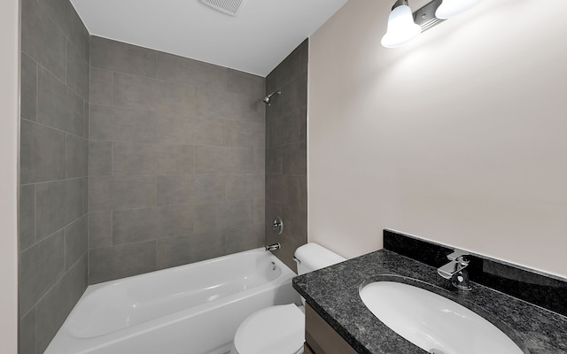 bathroom featuring vanity, toilet, visible vents, and shower / washtub combination