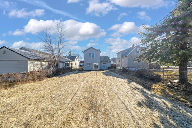 view of yard with a residential view and fence