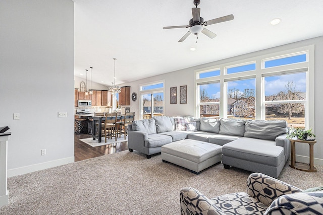 living room with recessed lighting, dark colored carpet, baseboards, ceiling fan, and vaulted ceiling