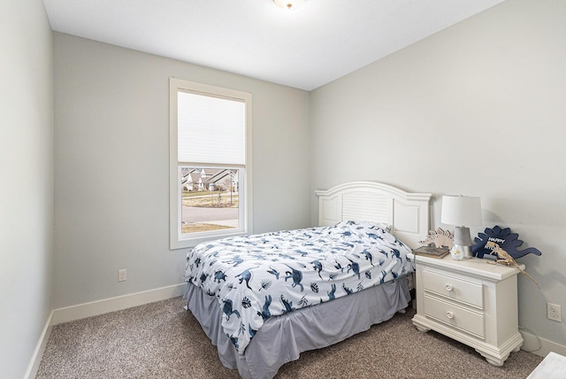 carpeted bedroom with baseboards