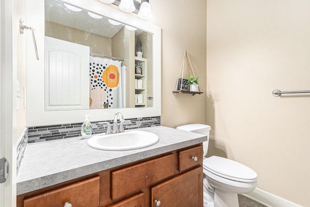 bathroom with backsplash, curtained shower, vanity, and toilet