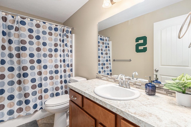 bathroom with backsplash, curtained shower, toilet, and vanity