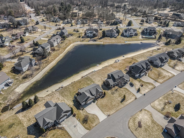 bird's eye view with a residential view and a water view