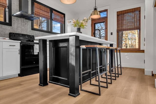 interior space with wood finished floors and baseboards