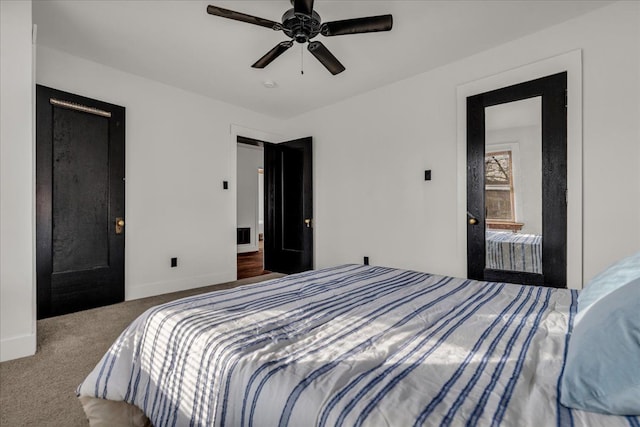 bedroom with baseboards, ceiling fan, and carpet flooring