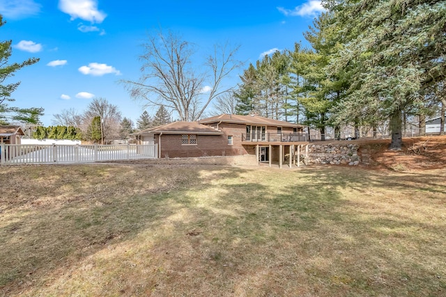 view of yard with a wooden deck and fence