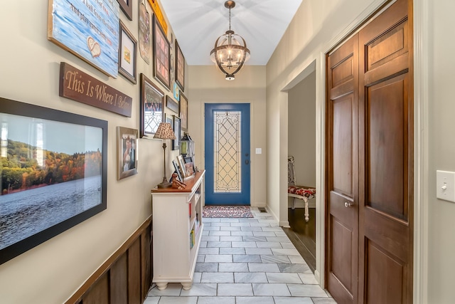 doorway featuring a chandelier