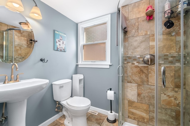 full bath featuring visible vents, toilet, a stall shower, tile patterned flooring, and baseboards