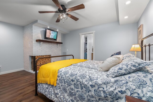 bedroom featuring a ceiling fan, recessed lighting, wood finished floors, and baseboards