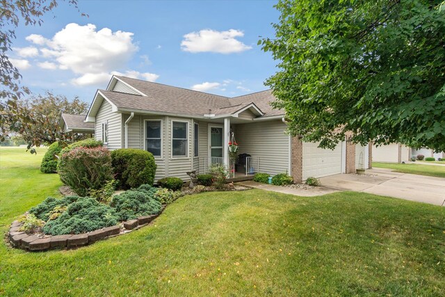 ranch-style home with driveway, a front yard, a shingled roof, a garage, and brick siding