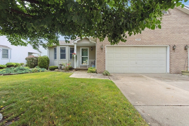 view of front facade featuring a garage, brick siding, concrete driveway, and a front yard