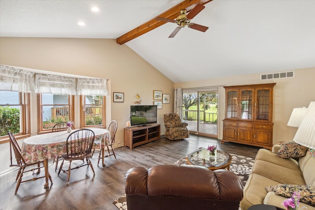 living area featuring ceiling fan, visible vents, beamed ceiling, and wood finished floors