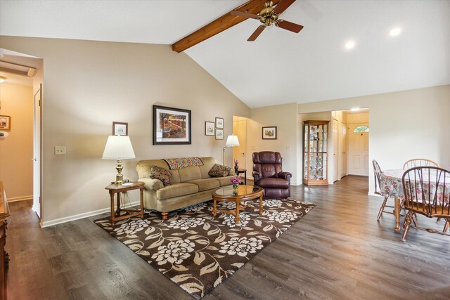 living room featuring ceiling fan, lofted ceiling with beams, baseboards, and wood finished floors