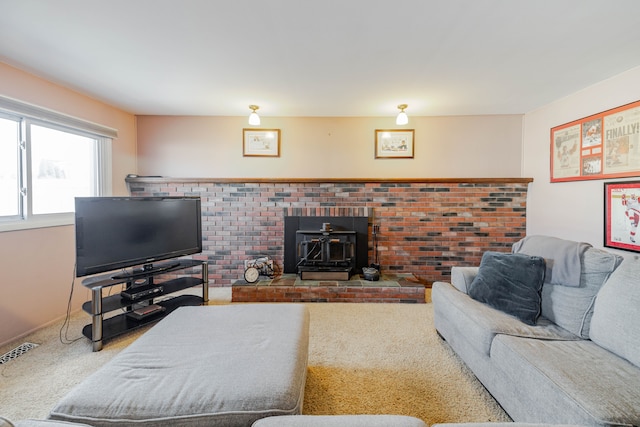 carpeted living area with visible vents and a wood stove