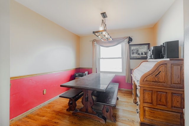 dining area with light wood finished floors