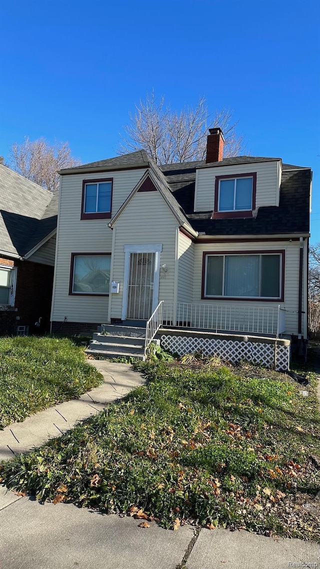 13522 Birwood St, Detroit, MI 48238 - view of front of home with a chimney and a front yard