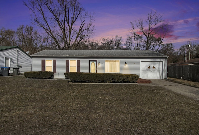 ranch-style house with a front lawn, concrete driveway, a garage, and fence