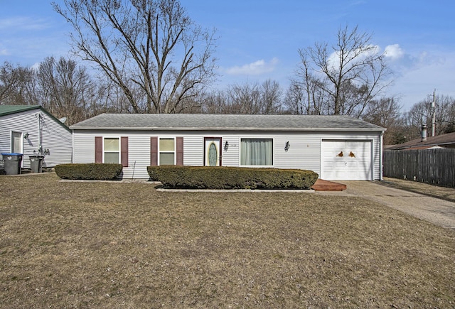 single story home featuring concrete driveway, fence, a garage, and a front lawn