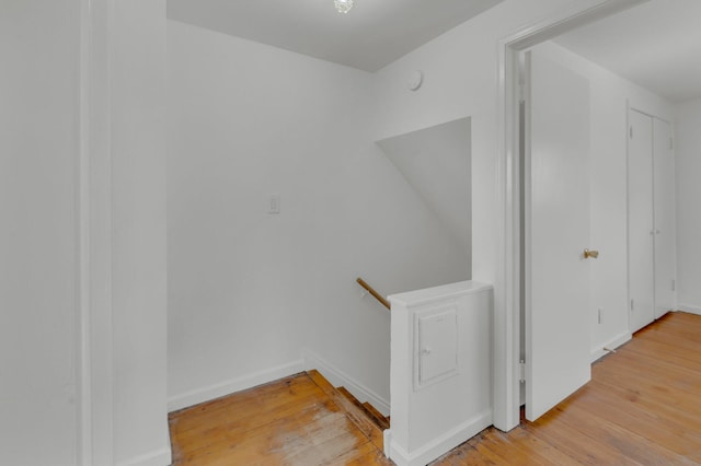 interior space with baseboards and wood finished floors