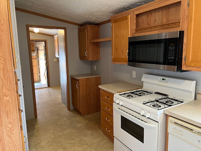 kitchen featuring white appliances, a textured ceiling, brown cabinets, and light countertops