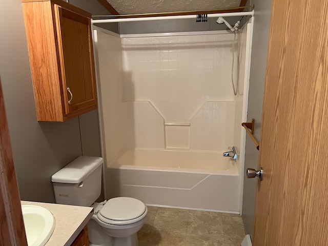 bathroom with toilet, vanity, and shower / bathtub combination