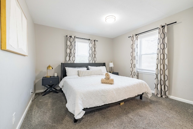 carpeted bedroom with multiple windows and baseboards