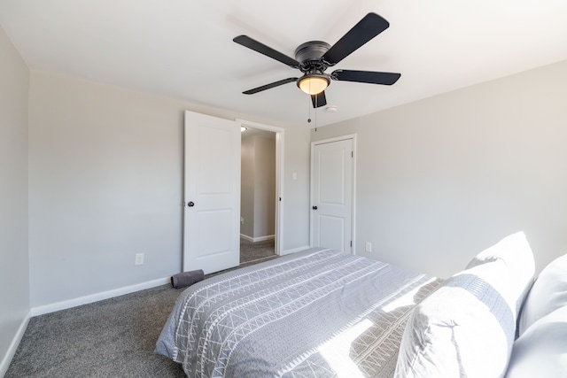 carpeted bedroom featuring baseboards and ceiling fan