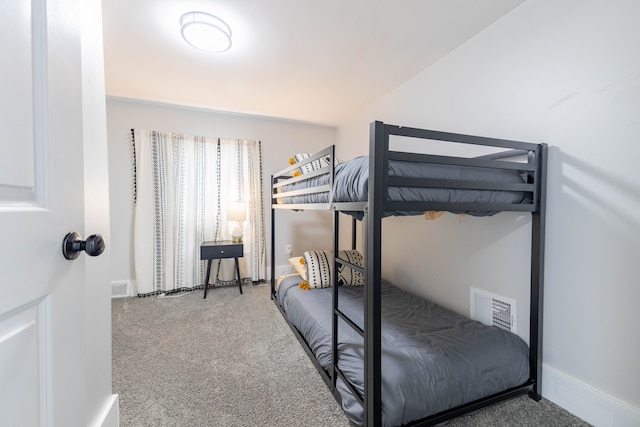 bedroom with carpet flooring, baseboards, and visible vents