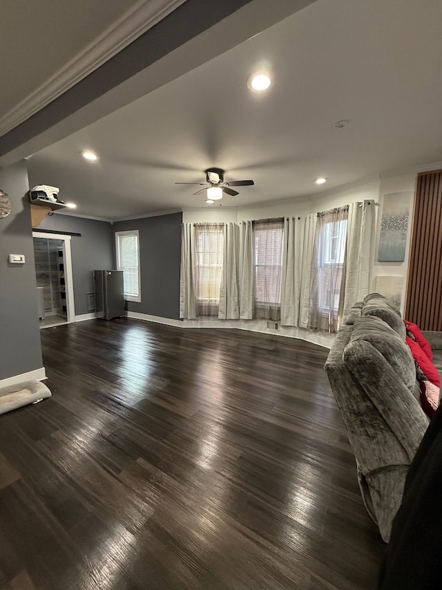 living room with a ceiling fan, wood finished floors, baseboards, recessed lighting, and crown molding